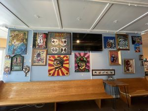 All of their paintings for sale in the coffee shop! at Nine Lives Cat Café in Indianapolis