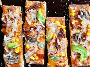 Homemade vegan pizza, made with all Trader Joe’s ingredients.🫶🏼 TJ’s pizza crust, Calabrian chili pasta sauce, cashew mozzarella with alll the veggie toppings. 10/10!!  at Trader Joe's in Kettering