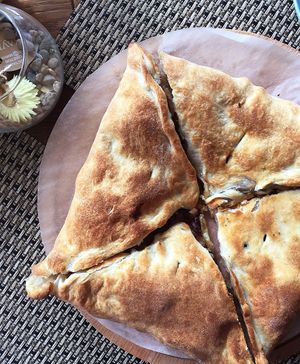 Georgian lobiani pie with puff pastry and red bean filling. Huge and delicious! at Dom Vkusa Sharden in Tula