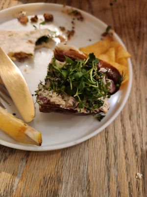 Half of a Lobster roll and remains of a taco in the back at Aunts et Uncles in Brooklyn