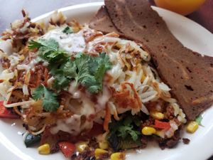 1/2 vegan el presidente with side of vegan maple bacon at The Nucleus in Eau Claire