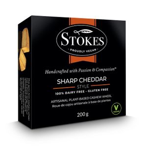 Bold, sharp, tangy semi-firm cultured cashew cheese wheel is the perfect addition to a delicious vegan charcuterie board. Delicious on crackers, grilled cheese and pizza. at Vegan Stokes Cheese in Markham