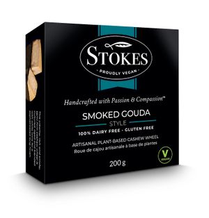 Exceptional rich and smoky cultured semi-firm cashew cheese wheel is blended with white wine for a robust, sophisticated finish. Perfect addition to level-up any charcuterie. at Vegan Stokes Cheese in Markham