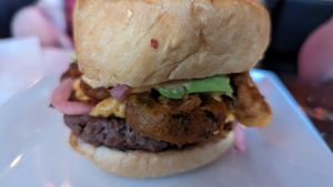 Jalapeno Bomb Burger - impossible burger, fried jalapeno, avocado, pickled onion, chipotle aioli, vegan cheese at Galaxy Hut in Arlington