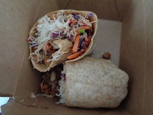 Thai Wrap - chickpeas subbed for chicken, Asian-inspired slaw, rice noodles, spicy peanut sauce, whole wheat wrap at Buckeye Chocolate Café Bainbridge in Auburn