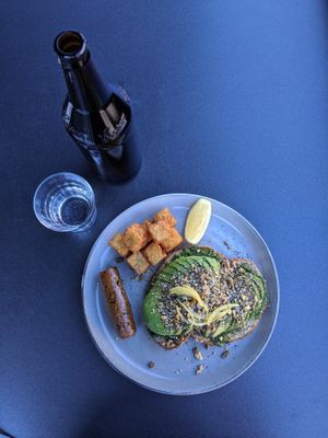 On the full menu (pre-Covid), a WHOLE avo on toast, vegan sausage and hash browns at Code Black Coffee in Brunswick