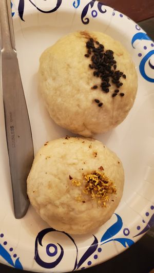 top tofu kale bun, bottom red bean bun at Cai's Dim Sum Catering in Brattleboro