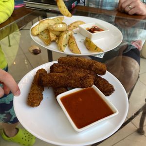 Faux mozzarella sticks and potato wedges   at Coral Restaurante in Cozumel