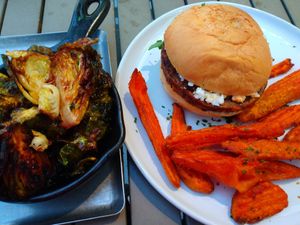 Vegan burger with vegan feta cheese, and sweet potato fries. And brussel sprouts. at Lake Park Diner in Naples