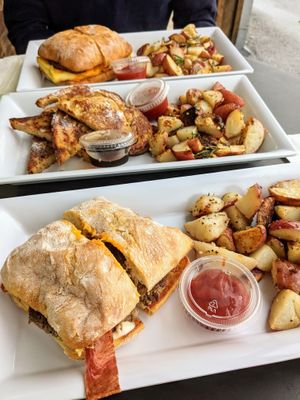 Bleu bird burger, french toast, Farmer John breakfast sandwich at Brunch Bird in Austin