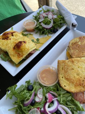 Eggs benedict and lumberjack with side salads at Brunch Bird in Austin