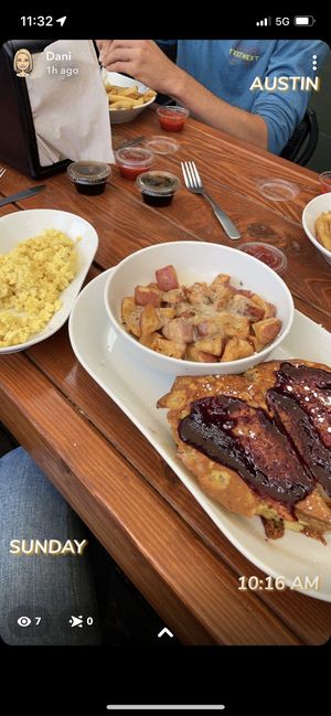 Stuffed Frenchie with gravy pots abs side of scrambles    at Brunch Bird in Austin