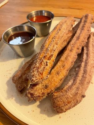 Churros with warm chocolate and strawberry dipping sauces at Rascal's in Santa Barbara