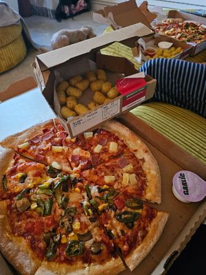 Vegan Hawaiian and Garden Party pizza with potato tots. at Papa John's UK EU in Mildenhall