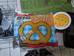 The frozen soft pretzels are vegan and they have a vegan cheese sauce at Trader Joe's in Reno