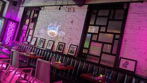 Old horror trailers projected on the wall at Monster Vegan in Philadelphia