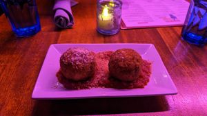 Breaded mac and cheese balls in marinara sauce at Monster Vegan in Philadelphia