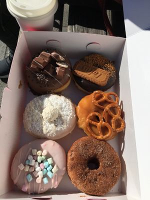 Vegan Lotus Cookie Donut with chocolate filling, caramel pretzel donut & cinnamon-sugar filled with apple sauce  at Royal Donuts in Augsburg