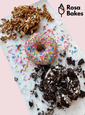 Vegan Donuts- chocolate peanut butter pretzel, vanilla sprinkle, and Oreo. at Rosa Bakes in Chantilly