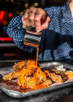 Crispy mock chicken ( seitan ) fingers, with 'Almost buffalo' sauce and vegan mayo. at MEATliquor in Croydon