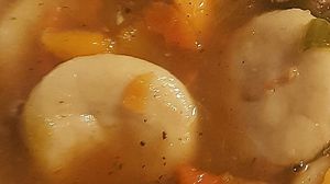 Boiled Dumplings in Jerk Gravy at V'ital by Moshan  in Swindon