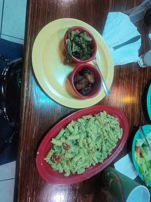 Collard greens, plantains  and Rasta Pasta at Red Stripes Caribbean Cuisine & Lounge in Hilton Head Island