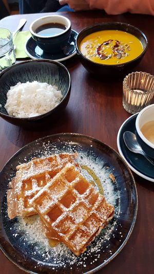 Pumpkin soup with jasmine rice, Belgian waffle with maple syrup at Mono Cafe in Munich