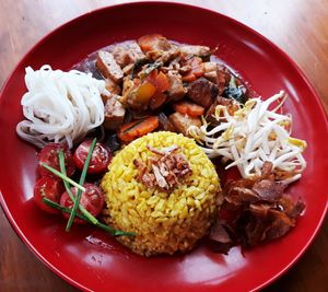 Braised tofu, carrots in mushroom & sauce served with  vermicelli, mung beans sprouts, tomatoes & yellow rice. at Gado Gado  in Westport