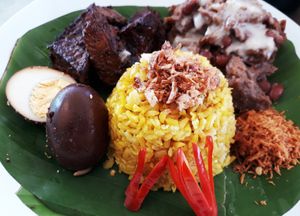 Gudeg  Traditional  Jogya foods  Caramelized tofu & tempeh, tasty young Jack fruits  combines with black beans served with yellow rice and shredded coconuts on top  at Gado Gado  in Westport