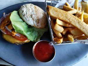 Burger was great! But look at that rock of a bun!! at Willow Vegan Bistro in New York City