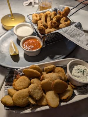 Fried pickle and fried calamari appetizers. Both excellent! at Willow Vegan Bistro in New York City