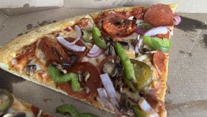 Vegan Toppers Classic with additional toppings: garlic-roasted tomatoes and fire-roasted jalapeños   at Toppers Pizza - South Blvd in Charlotte