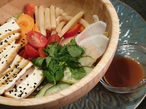 Lotus salad - a bunch of fresh herbs and veggies, fruit
 at Bumi - Pursimiehenkatu in Helsinki
