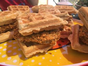 Chkn and Waffle Sandwich— Crispy fried Spacecat Chkn patties between fluffy waffles with maple butter (vegan)  at Spacecat V-stro in Ferndale