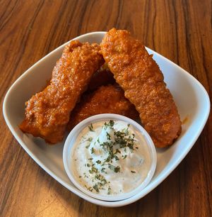 Frankie’s Hot Chkn Fingers- Spacecat Chkn fingers tossed in Frankie’s Hot Sauce and served with house dill ranch (vegan)  at Spacecat V-stro in Ferndale