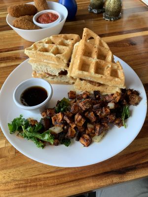 Chicken and waffles with potatoes  at Spacecat V-stro in Ferndale