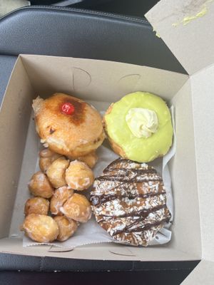 (From top left clockwise): Pineapple upside down, pistachio lemon, Samoa, and donut holes  at Donut Run in Washington