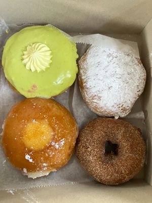 Clockwise from top left: pistachio lemon, guavalicious, apple cider, and creme brulee at Donut Run in Washington