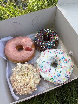 Strawberry and vanilla donuts, chocolate and coffee cake cake donuts  at Donut Run in Washington