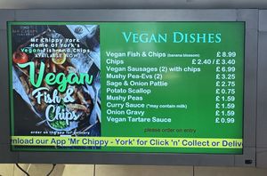 Vegan menu - if you can’t see it on display, wait a few minutes as it cycles with adverts.   at Mr Chippy in York