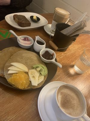 Pancakes with rose jam and coconut yoghurt. Banana bread w vegan butter   at Moon To Moon in Mount Victoria