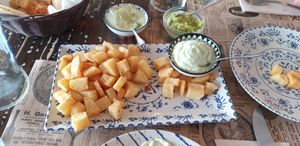 Patatas bravest with vegan allioli and guacamole at 13 Bistrot in Fuerteventura