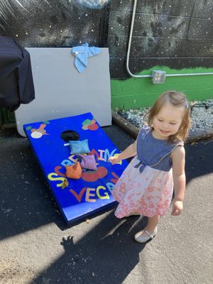 Bean bag toss game out back while waiting a short time for our food   at Screaming Vegan in Roanoke