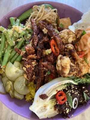 Their current (May ‘21) menu. This is take away that I mashed together on a plate at home. at Indo Food House in Utrecht