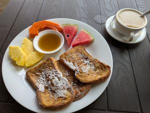 Vegan french toast with maple syrup and tea with oat milk at Thirema Coffee Shop and Restaurant in Tortuguero