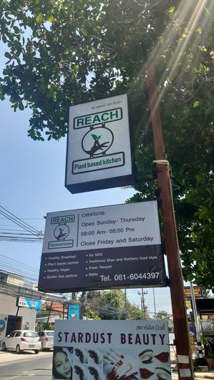 Outside banners at Reach Plant Based Kitchen in Phuket