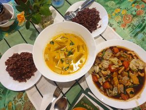 Pumpkin curry and Cashew tofu tamarind sauce with extra rice at Reach Plant Based Kitchen in Phuket