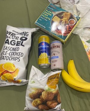 Crisps, limonata, plant based fish, coffee, bananas and falafels   at Trader Joe's in Boston