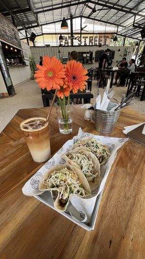 Vegan pulled pork tacos and iced vanilla oat milk latte   at Eat Street in Santa Teresa