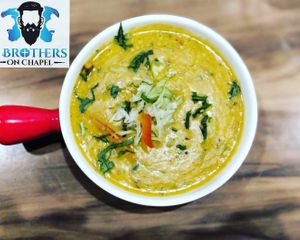 Yellow Daal Tadka - Yellow split lentils cooked with onion, tomato and garam masala. at 3 Brothersss in Melbourne